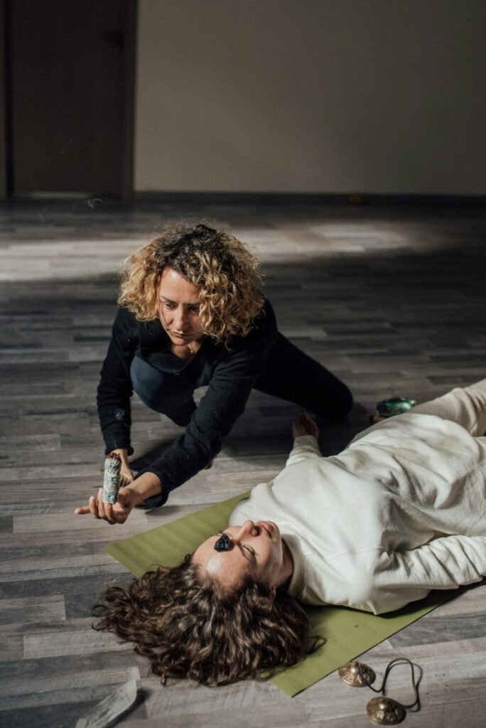 a woman performing a reiki healing session